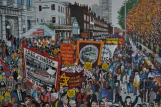 A painting showing an anti-racist march through Cable Street.