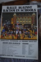 A poster for a rally against racism in schools.