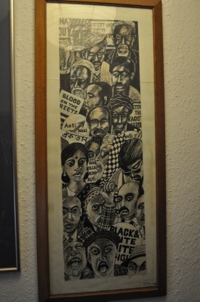 A poster showing faces in an anti-racist demo.